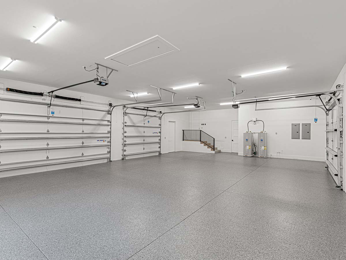Custom Built Home by Charter Bay Home Builders | Keystone Lake – Odessa, FL (Hillsborough County) Interior view of the garage of a custom home built by Charter Bay Home Builders in Odessa, FL on Keystone Lake.